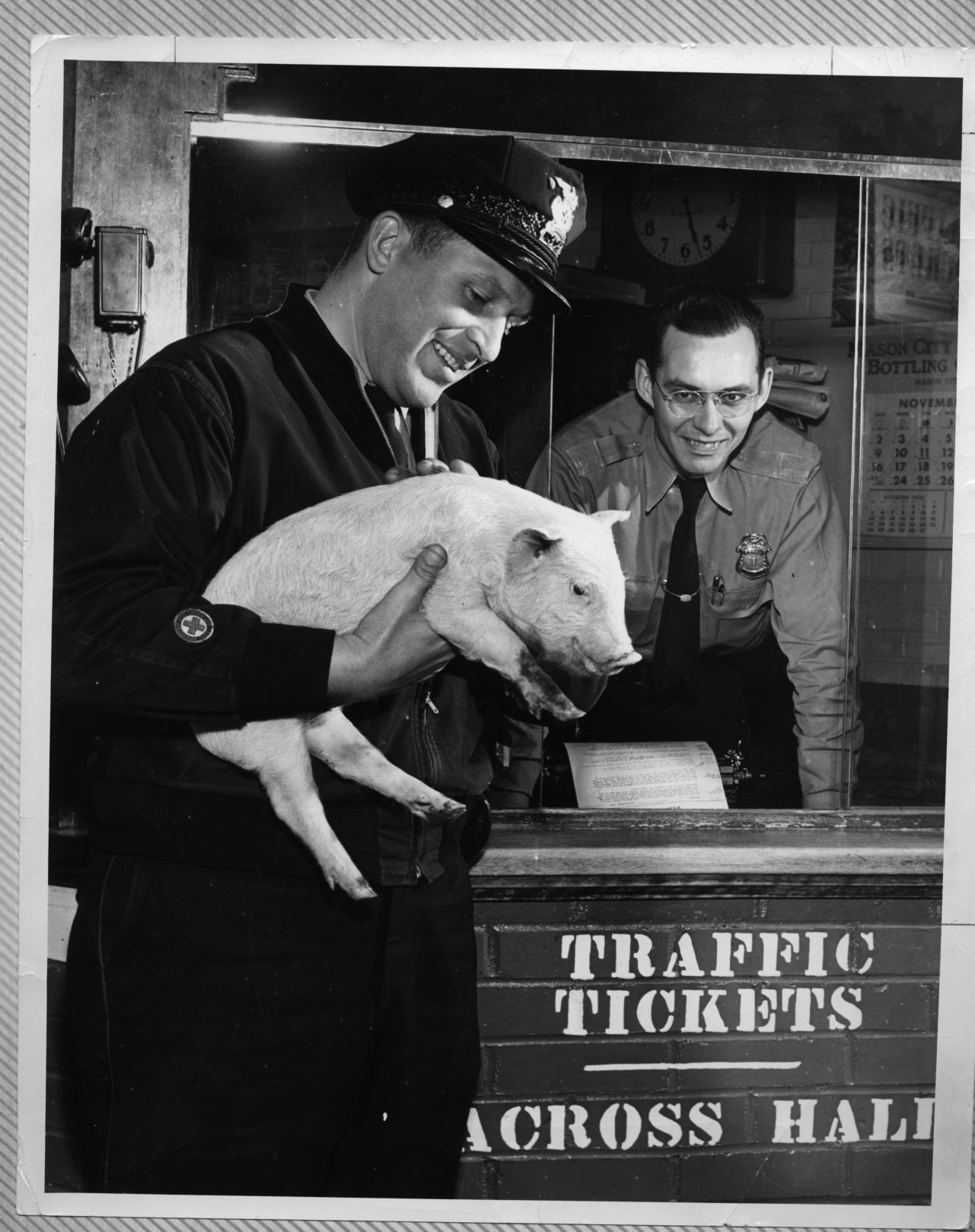 Statzer and Stephens with pig at old station.